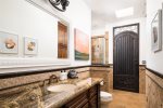En-suite bathroom with walk in shower and backyard access